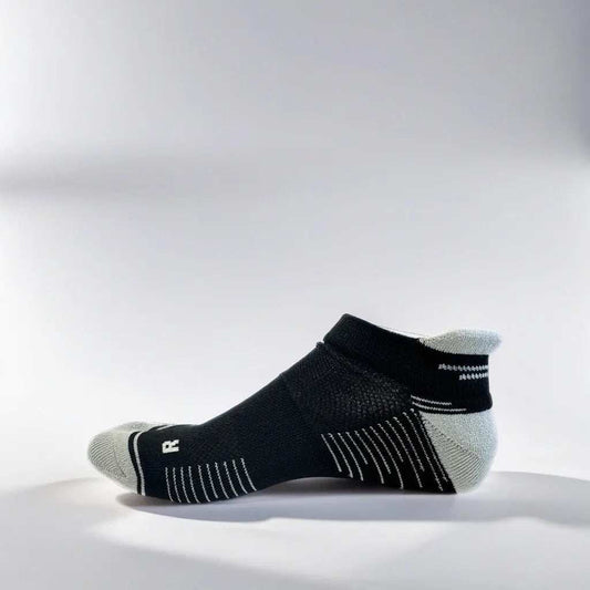 Low cut black and grey running socks with arch support and ventilation designed for comfort and stability during runs
